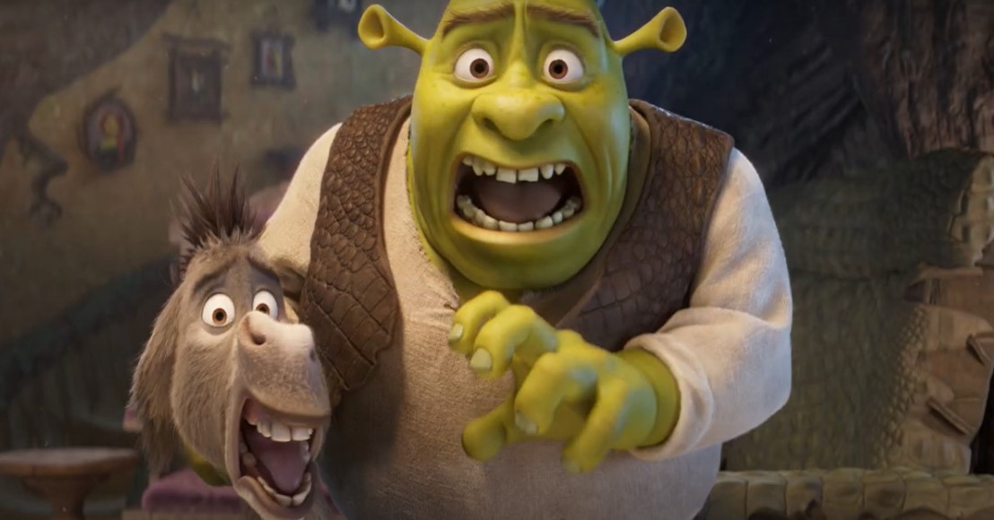 Shrek e Ciuchino sorridenti, pronti per un'avventura nel loro mondo incantato.